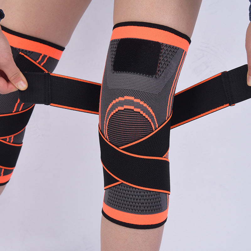 Kniebandage mit Kreuzgurt und orangefarbenem Rand